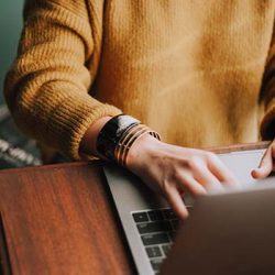 person on laptop to illustrate food safety e-learning