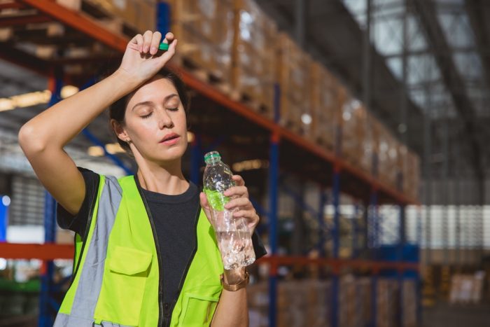 Worker sweating in warehouse