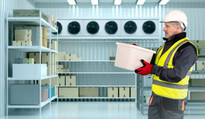 man in freezer wearing winter food PPE